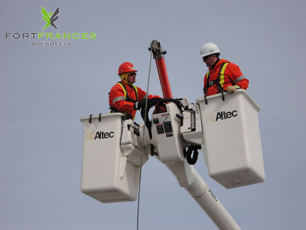 Fort Frances power corporation and hydro one workers in bucket
