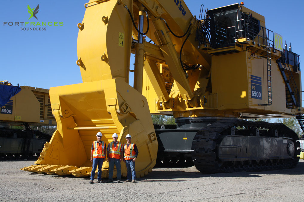 NewGold employees next to new equipment at Rainy River Project