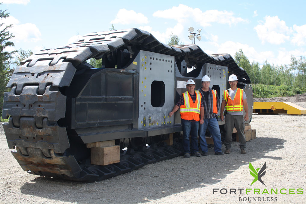 NewGold employees next to new equipment at Rainy River Project